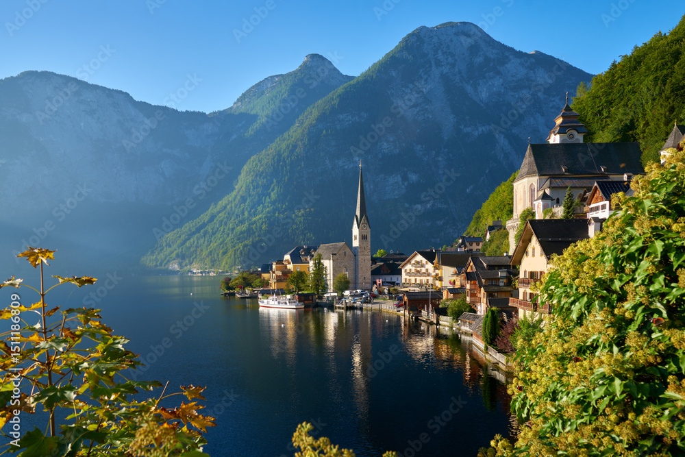 Fototapeta premium Passenger Ferry at Dock Hallstatt Village. The passenger ferry docked at picturesque Hallstatt village, Austria.