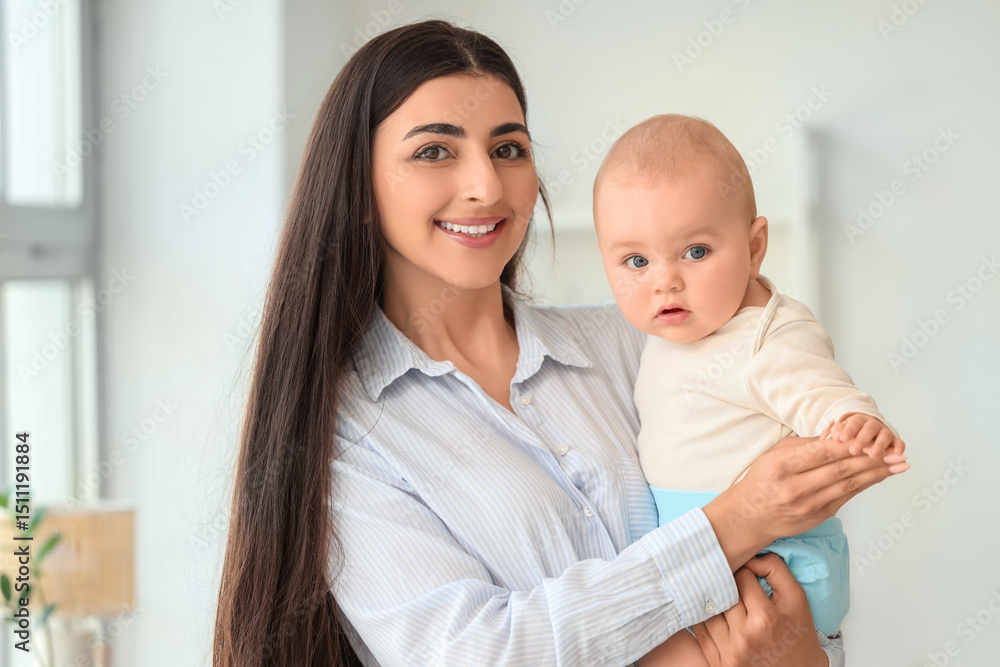 Beautiful young happy mother with her cute little daughter at home Beautiful young happy mother with her cute little daughter at home