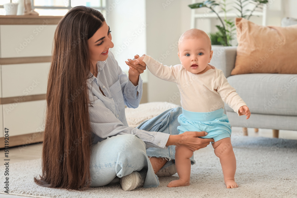Young happy mother with her cute little daughter sitting on floor at home Young happy mother with her cute little daughter sitting on floor at home