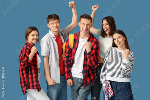 Group of happy students on blue background