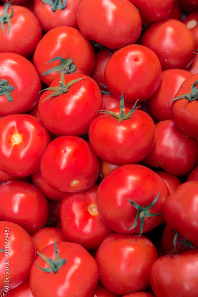 Fresh red tomatoes displayed at farmers market in summer Fresh red tomatoes displayed at farmers market in summer
