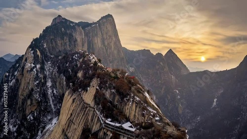 The magnificent sunrise over the clouds and sea of Mount Hua, showcasing the magnificent landscape.