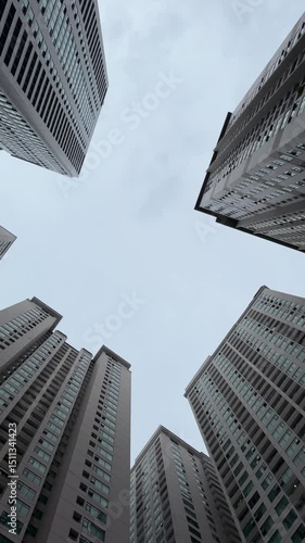 Vietnam, Nha Trang - 29.05.2025 - Skyscrapers, view from the bottom up, large buildings, man, high-rise building in Asia, luxury residential complex Oceanus, Muntian