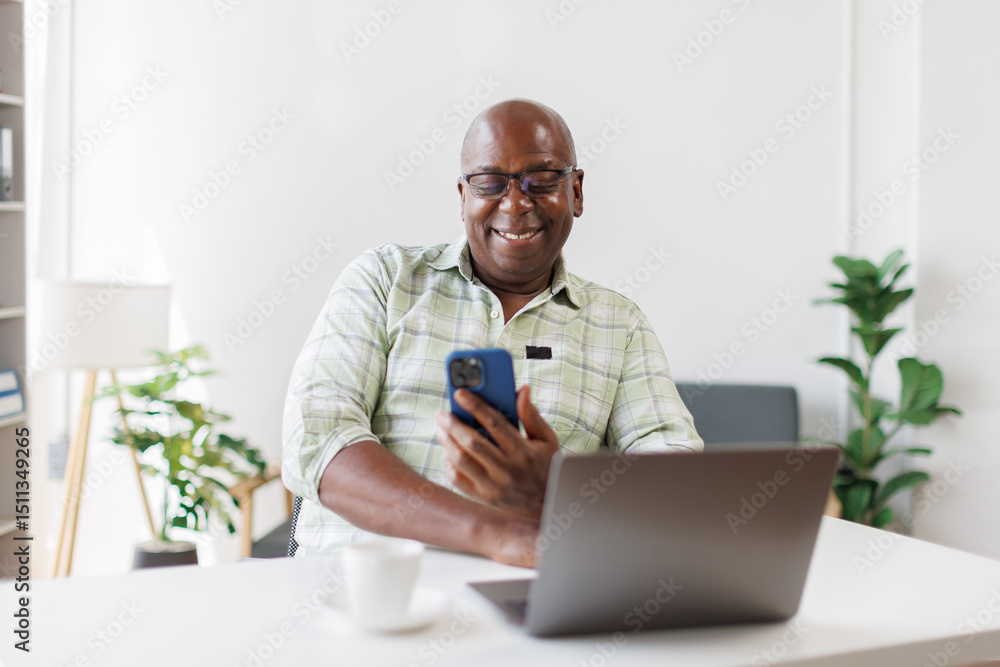 Attractive and happy senior man in workplace using he smartphone while relaxing at work.people and technology concept
Attractive and happy senior man in workplace using he smartphone while relaxing at work.people and technology concept