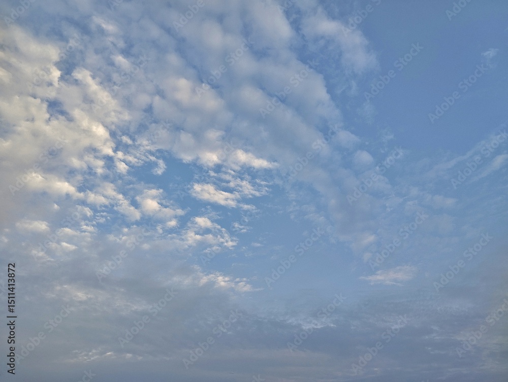 Obraz premium Bright blue sky with scattered clouds in the morning, summer sky landscape 