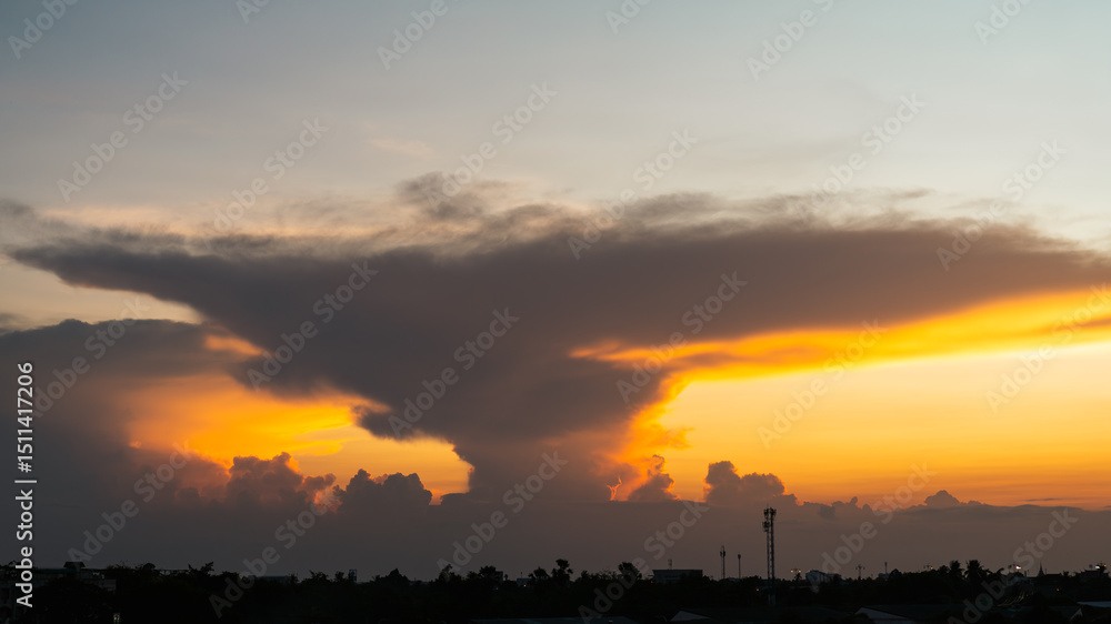Obraz premium Landscape of clouds in the sky resembling a tornado during sunset. Concept of beauty and variability of weather that changes every day.
