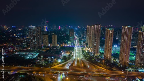 Wallpaper Mural Aerial night timelapse of Hanoi, Vietnam, showing illuminated skyscrapers, vibrant traffic, and glowing city lights. Ideal for urban, travel, and infrastructure themes. Torontodigital.ca