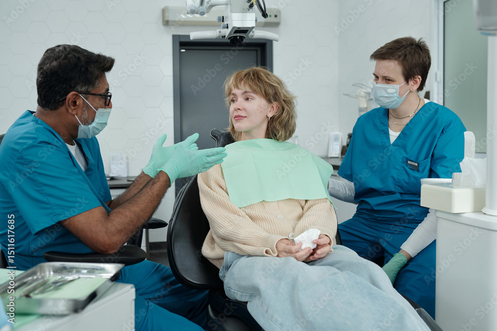 Dentist Giving Recommendations to Woman after Checkup Dentist Giving Recommendations to Woman after Checkup