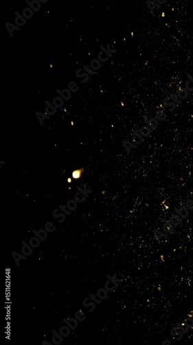 Abstract background of sparkling golden dust particles floating in dark space, illuminating and adding depth and texture to the scene