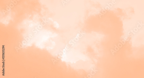 Dramatic light and clouds moving over the sky. background of peach fuzz sky with the white cloud fluffy. peach fuzz colored trend color