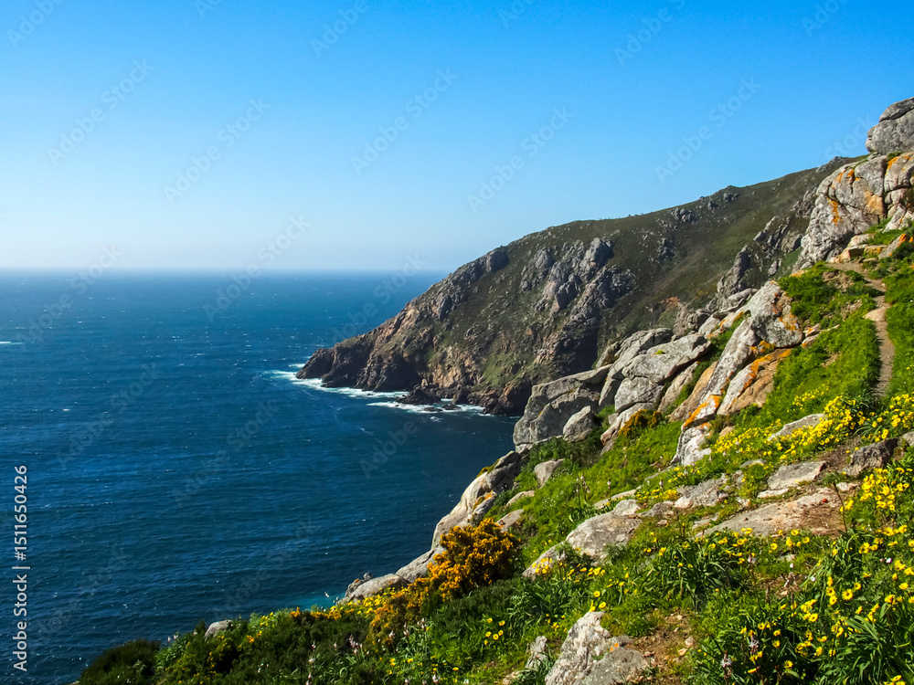 Rugged Cliffs and Wild Coastline at Cape Finisterre (Fisterra), A Coruña, Galicia, Spain. Rugged Cliffs and Wild Coastline at Cape Finisterre (Fisterra), A Coruña, Galicia, Spain.