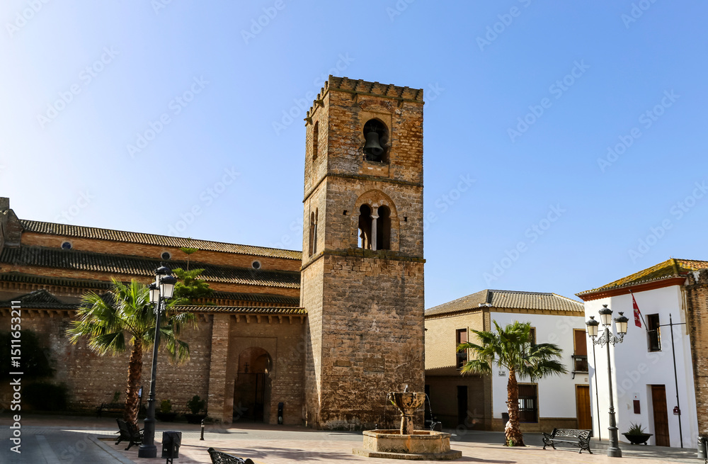 Obraz premium Historic 12th Century Santa María de la Granada Church Bell Tower in Niebla, Spain