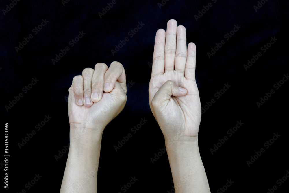 Fototapeta premium Unity Gesture Fist and Open Palm Hands Against Black.