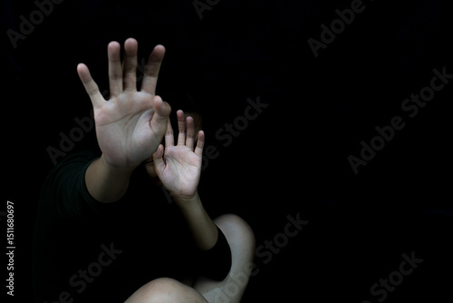 Cuadro en lienzo Fearful Stop Hands Raised in Darkness Against Abuse and Violence.