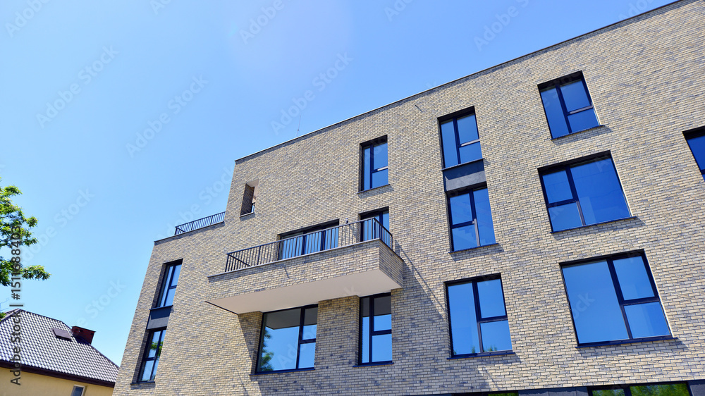 Modern new residential apartment house building complex. Exterior view of modern apartment building. New construction apartment or condo complex. Modern new residential apartment house building complex. Exterior view of modern apartment building. New construction apartment or condo complex.