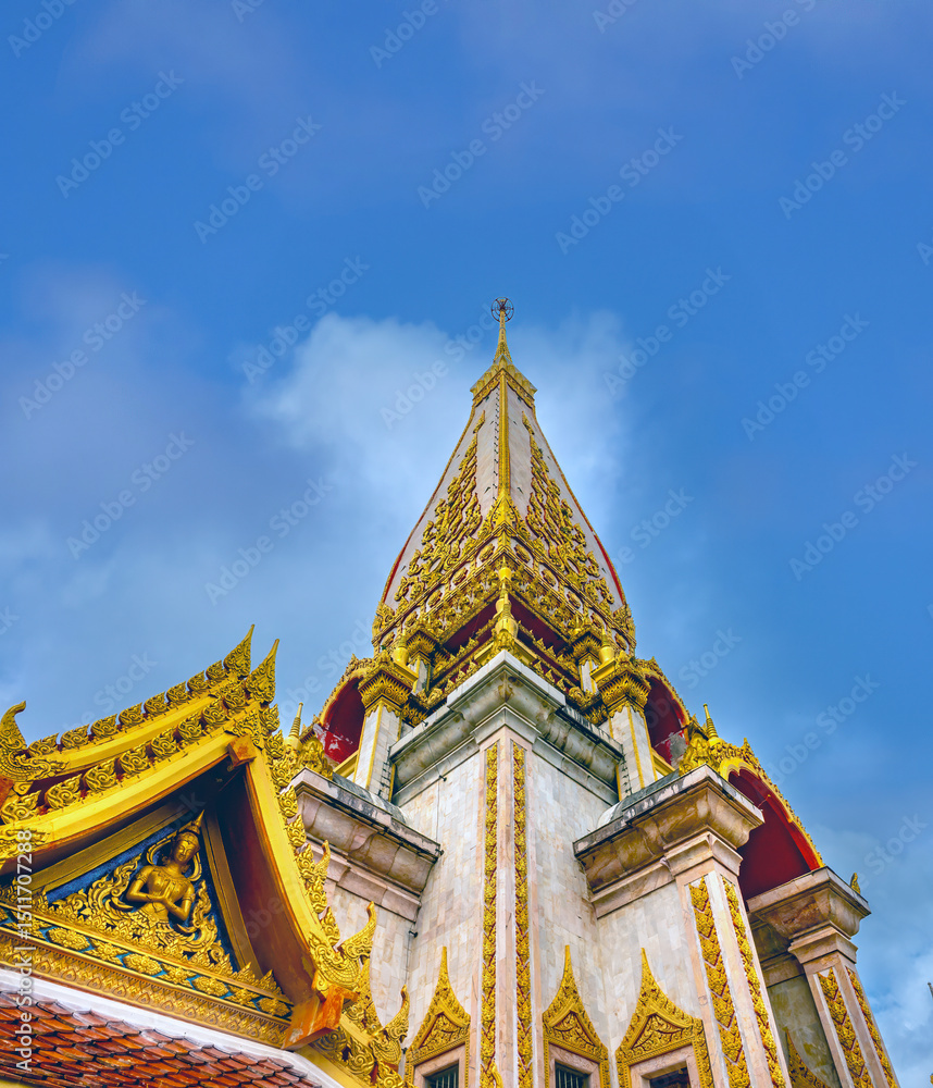 Fototapeta premium The stunning pagoda (Chedi) of the Wat Chalong Temple, housing a relic from the Buddham Phuket, Thailand