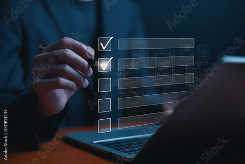 Business performance checklist concept, Businessman using laptop take an assessment, An businessman checklist online survey filling form list options business employee security procedures.
