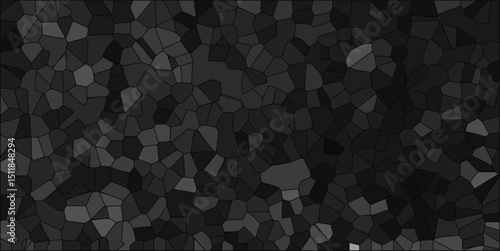 Abstract mosaic pattern of gray and black irregularly shaped polygons with varying shades creating a dark textured background design.