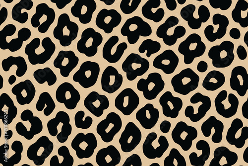 Seamless leopard print pattern with bold black spots