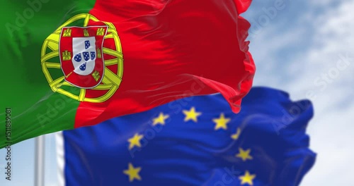 Close-up of Portugal and the European Union flags waving on a clear day