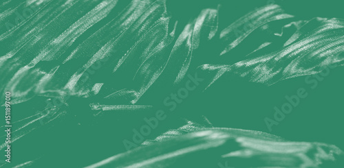 Soft and radiant fabric folds with a focus on layered textures and elegant, embroidered details in a polished, stylish presentation.