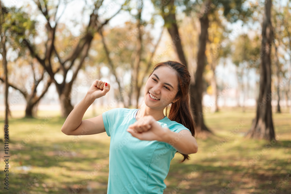 Close-up of A Cheerful Woman Stretching Outdoors, Morning Warm-Up in the Park Close-up of A Cheerful Woman Stretching Outdoors, Morning Warm-Up in the Park