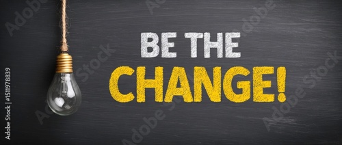 Inspirational Message on Blackboard with Lightbulb Be the Change Concept Motivation