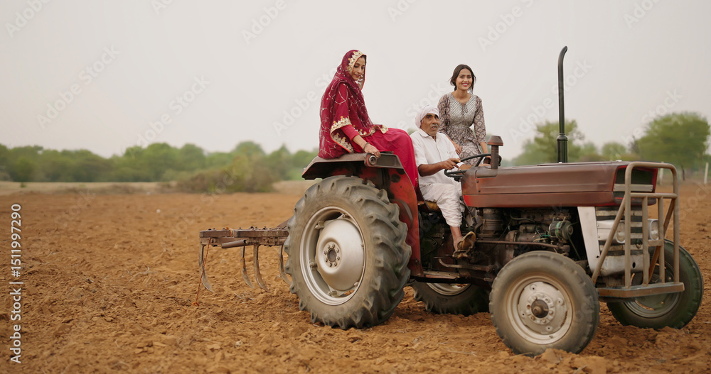 Obraz premium Indian village farmer young woman lady wear red saree smiling sitting on tractor outdoor Asian mother with teen age girl talk gossip old aged male man driving outside farm rural area enjoy desi life