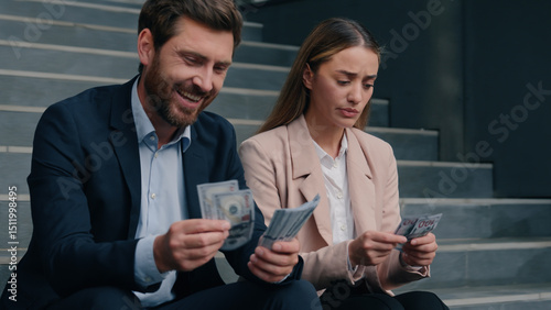 Fotografie Caucasian colleagues man woman count money salary business financial inequality