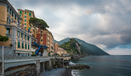 The picturesque colorful houses against a backdrop of mountains at Mediterran...