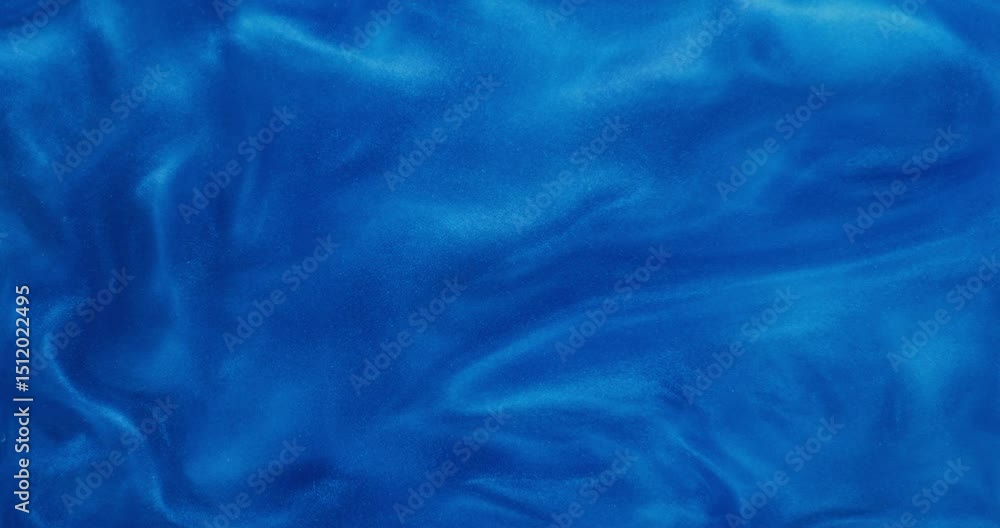 Abstract background. The blue shiny liquid is bubbling and shimmering Abstract background. The blue shiny liquid is bubbling and shimmering