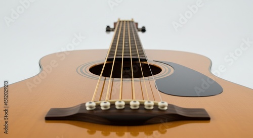 Acoustic guitar close up showing strings bridge and sound hole on white background.