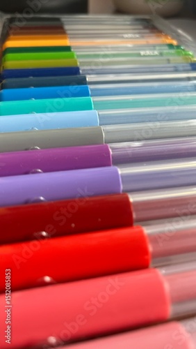 Colorful arrangement of art markers in various shades displayed on a flat surface highlighting creativity and artistic expression