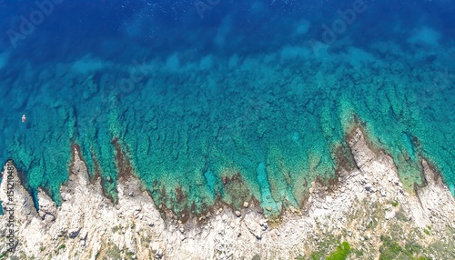 Clear Blue Sea and Rocky Shore