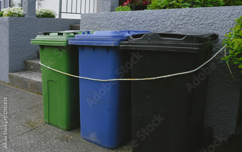 Colorful Recycling Bins for Waste Sorting Outside Residential House. Eco-Friendly Waste Separation System in Iceland.