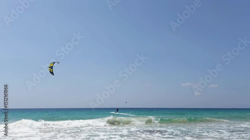 Athlete trains the kitesurfing on the Mediterranean coast in northern Israel
