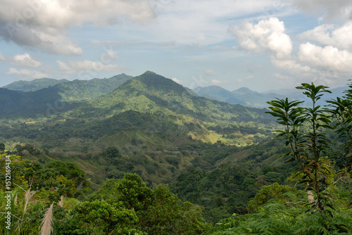 green big mountains landscape with trees and clouds in sierra nevada of santa marta in colombia 