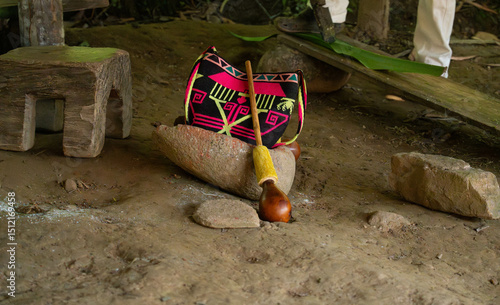 Mochila Indigenous colorful bag, stone mortar, and Quimbaya poporo, indigenous peoples of Colombia ancestral traditions pre columbian 