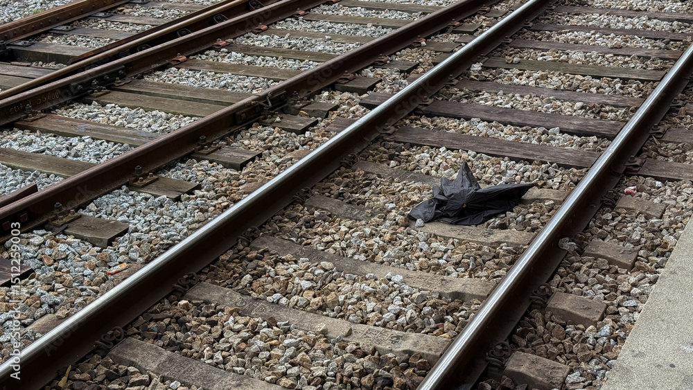 broken black umbrella, capturing urban solitude with echoes of Train Day and the Festival of Silence broken black umbrella, capturing urban solitude with echoes of Train Day and the Festival of Silence