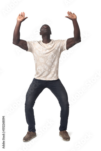 Front view of a standing man holding or pushing something imaginary upwards.