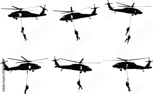 Black hawk helicopter rappelling soldiers silhouettes