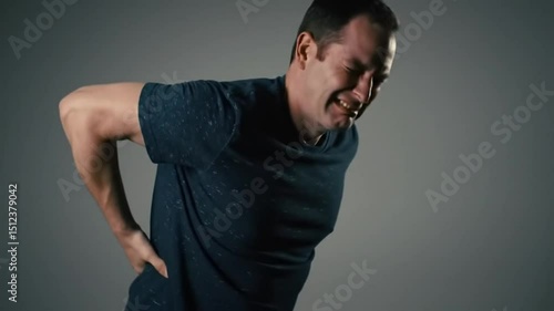 Man experiencing severe lower back pain