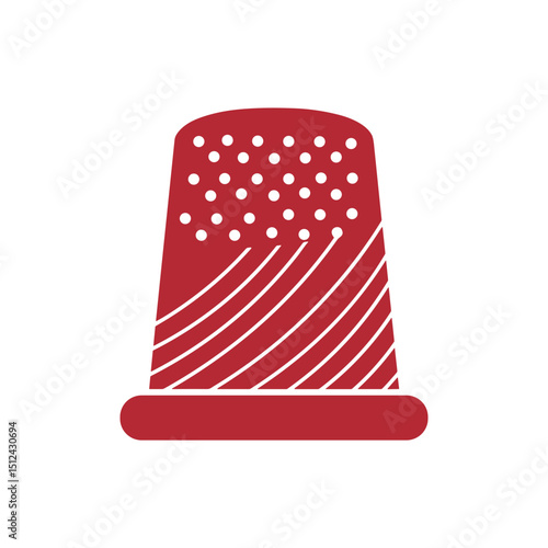 Red sewing thimble with dotted pattern for crafting and sewing  