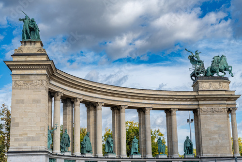 An aesthetic view of Heroes' Square in Budapest, Hungary, showcasing the grandeur of the Millennium Monument and its majestic statues
