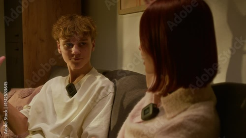 Wallpaper Mural Curly teen boy discussing new ideas of podcast with his female teammate who sitting in front of him and doing high five Torontodigital.ca