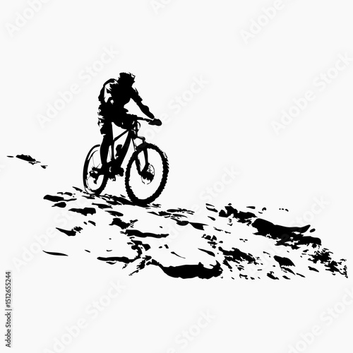 Mountain biker riding downhill on rocky terrain in silhouette  