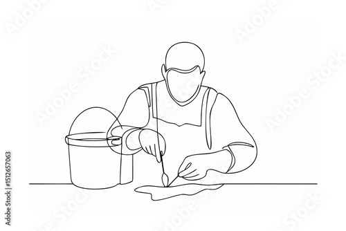 Person mixing paint in bucket using tools