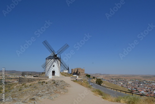 Historic spanish windmills on a clear day overlooking countryside. Consuegra. La Mancha. Spain