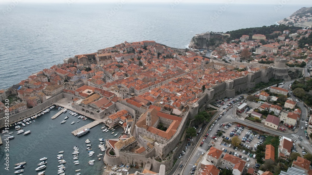 Obraz premium Stunning aerial view of Dubrovnik showcasing historic architecture and coastal beauty during midday 