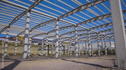 Wallpaper Mural Modern Concrete Building Under Construction with Large Structural Walls and Columns, A modern concrete building under construction showing large reinforced walls and structural columns at an active  Torontodigital.ca